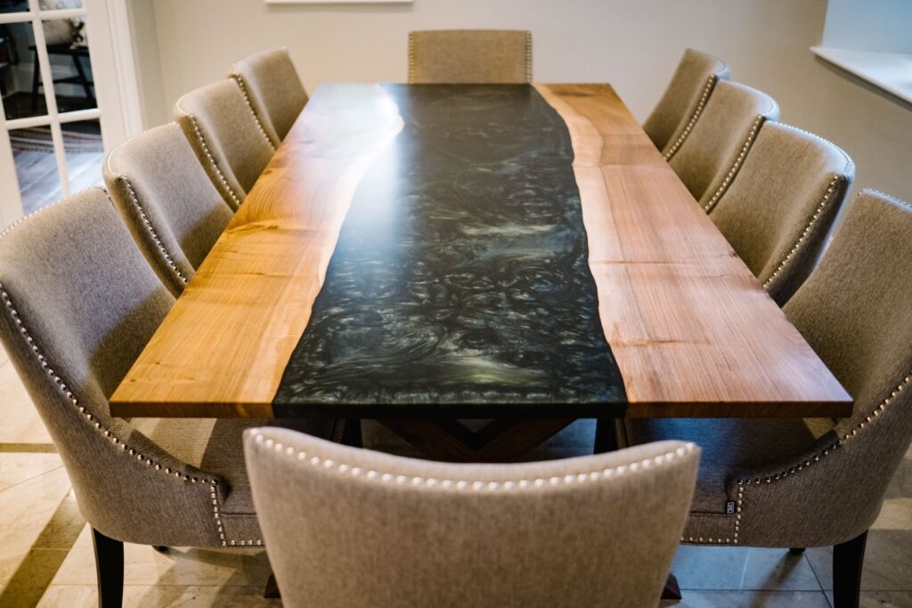 Combining resin and wild walnut, this dining table really enhances the beauty of nature by adding an artistic modern twist and delivering striking craftsmanship perfection. Designed by Charlotte Findlater Design, an award winning interior design studio specialising in luxury, high-end residential & commercial projects that respect time, nature and people.