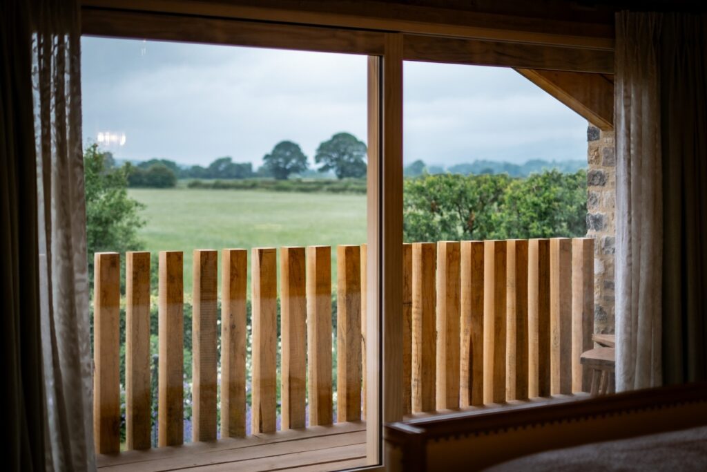 View out to the balcony with oak post railings