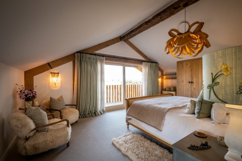 Nature and Spring design inspired master bedroom with natural carpet, bespoke cabinetry and handmade applique lamps