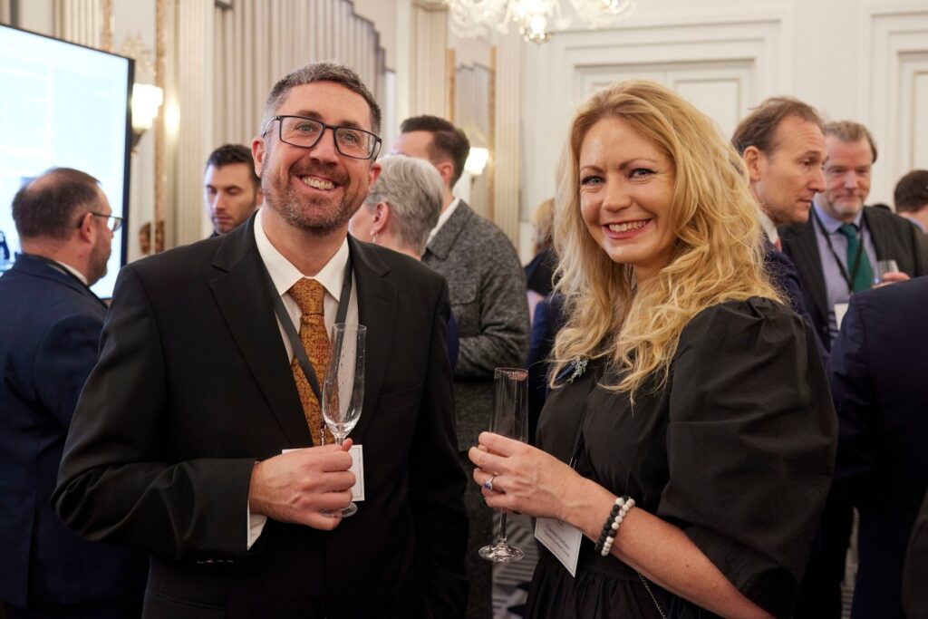 Charlotte Findlater and Scott Findlater with champagne glasses at His Majesty King Charles III at 75: The Leadership and Vision of King Charles III, at Claridge’s in central London on His Majesty’s 75th birthday.