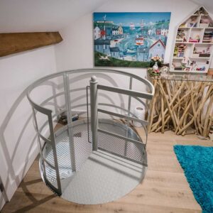 Bespoke metal spiral staircase enclosed in a spherical perforated steel design