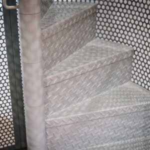 Bespoke metal spiral staircase enclosed in a spherical perforated steel design