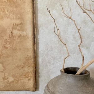 Large pot with a branch sat in it