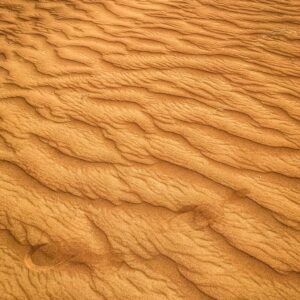 Sand with footprints and ripples