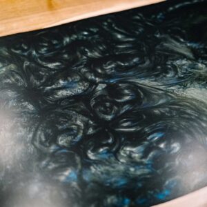 Close up of the resin of a bespoke dining table made from combining resin and wild walnut to create a river resin design