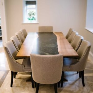 Bespoke dining table made from combining resin and wild walnut to create a river resin design with seating for 8
