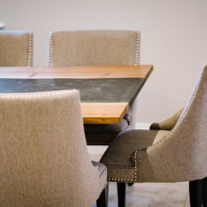 View of the end of a bespoke dining table made from combining resin and wild walnut to create a river resin design
