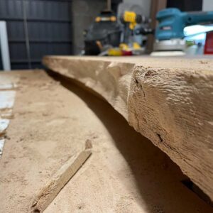 Raw wild walnut slabs before combining resin and wild walnut to create a bespoke river resin dining table.