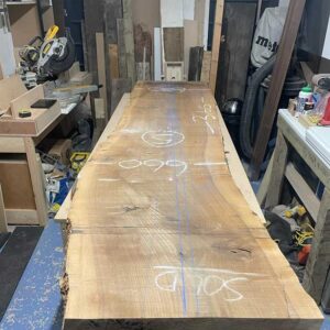 Raw wild walnut slab before combining resin and wild walnut to create a bespoke river resin dining table.