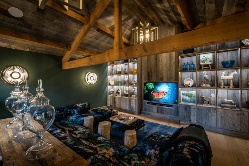 The cinema room of a Lake District barn renovation project. Filled with full audio visual technology and lighting designs. Furnished with bespoke hand crafted reclaimed wood cladding and built in units. Designed by Charlotte Findlater Design, an award winning interior design studio specialising in luxury, high-end residential & commercial projects that respect time, nature and people.