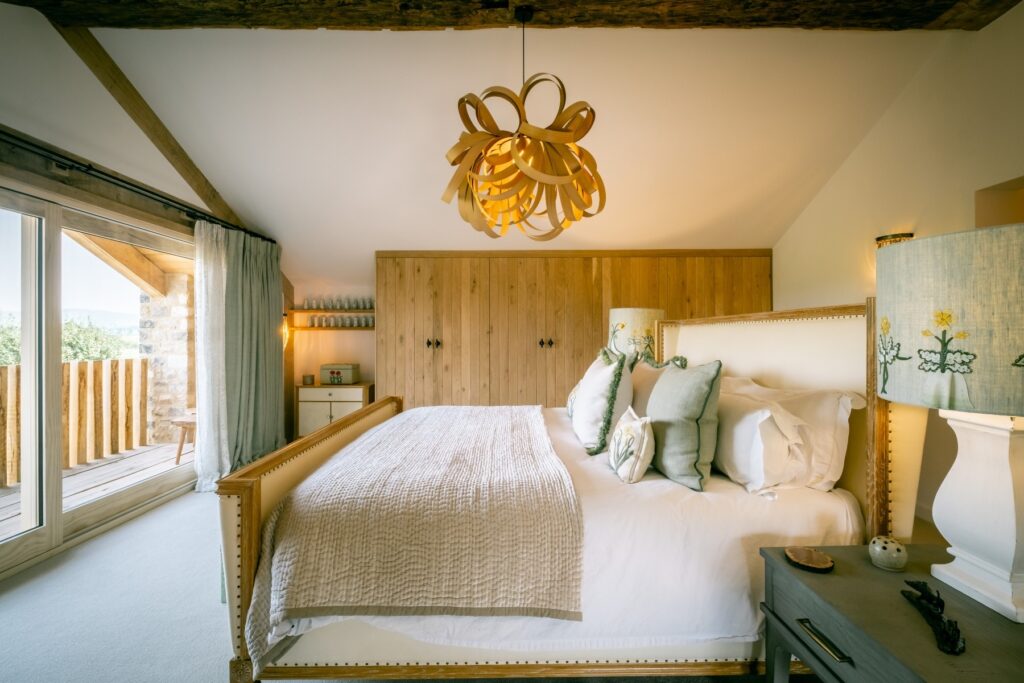 Nature and Spring design inspired master bedroom with emperor bed and oak bent pendant light
