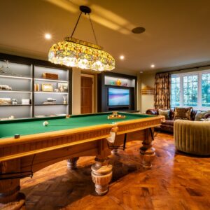 Luxury games room with bespoke Oak pool table, parquet flooring, built ins and media wall