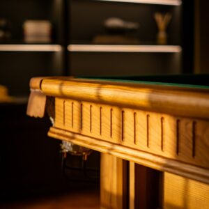 Close up of the Oak edge of a pool table