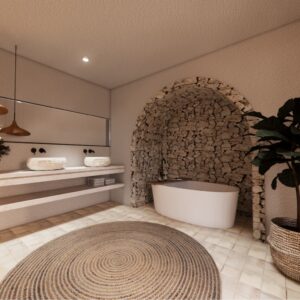 A render of a traditional Menorcan farmhouse stable styled outbuilding bedroom ensuite with a bath inset in a stone arch recess and his and hers sinks set on a stone worktop